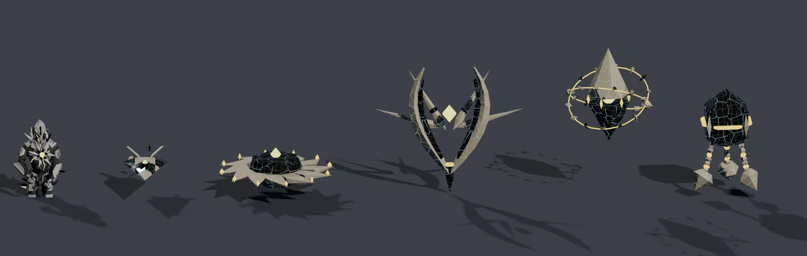 Six Harrow models from the build on a grey ground: cut-gem constructs of dark and ivory glass with thin gold cracks, from a small shard to a winged diamond and a ringed bell.